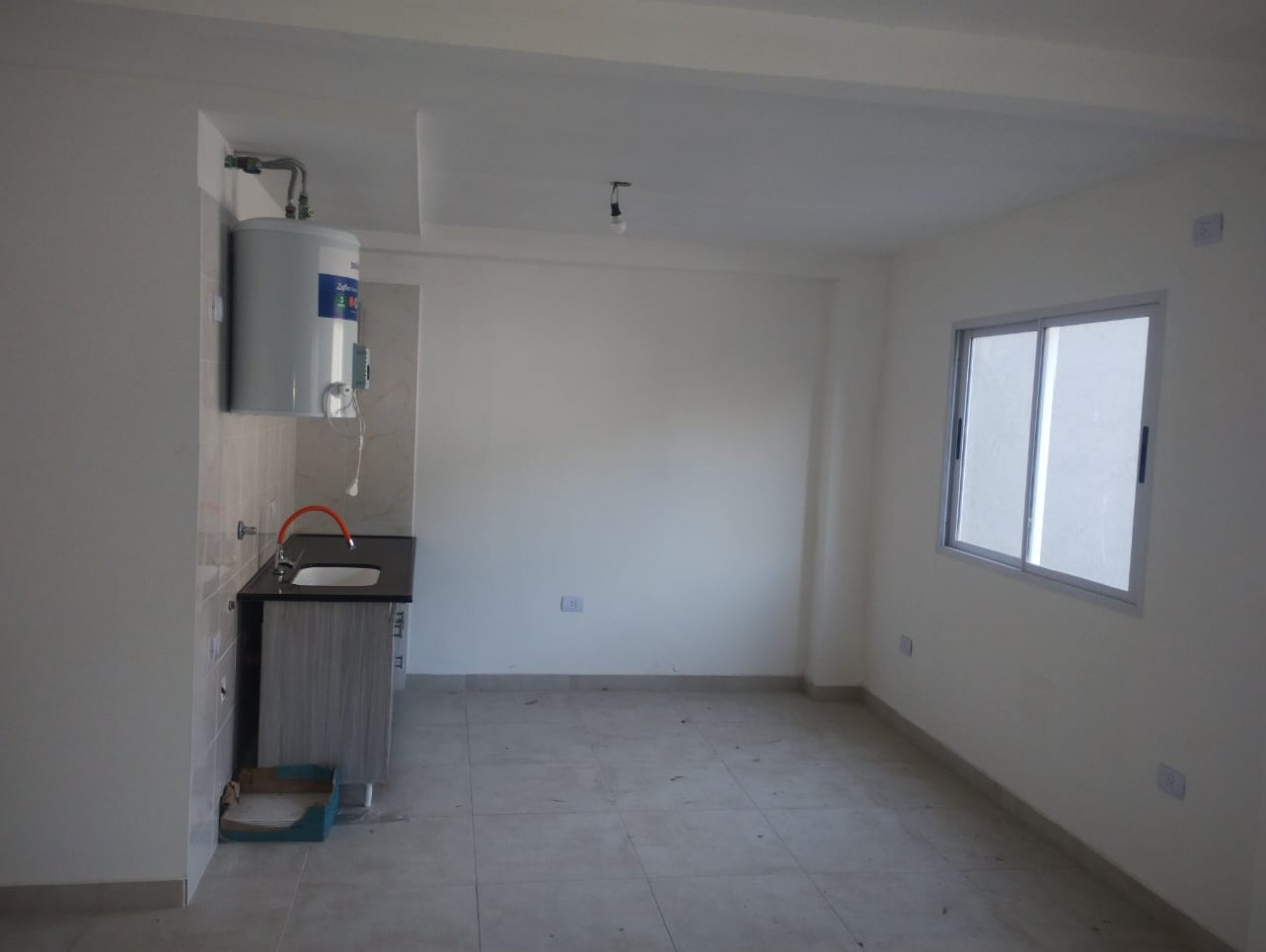 ALQUILO REGIO DEPARTAMENTO CON COCHERA, PLANTA BAJA EN MORENO CENTRO, EDIFICIO MADIBA VII,  CALLE DE LA QUINTANA 270 -MORENO